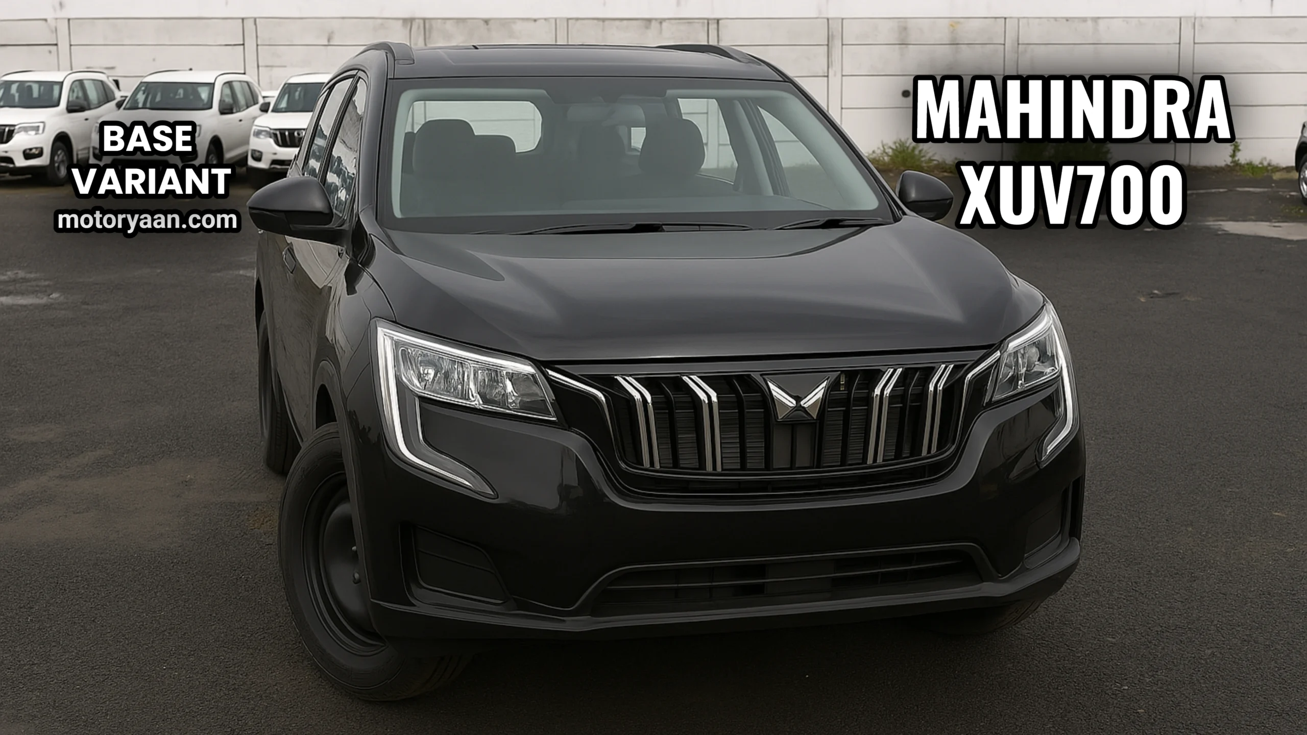 Mahindra XUV700 MX front profile with halogen headlamps and black grille