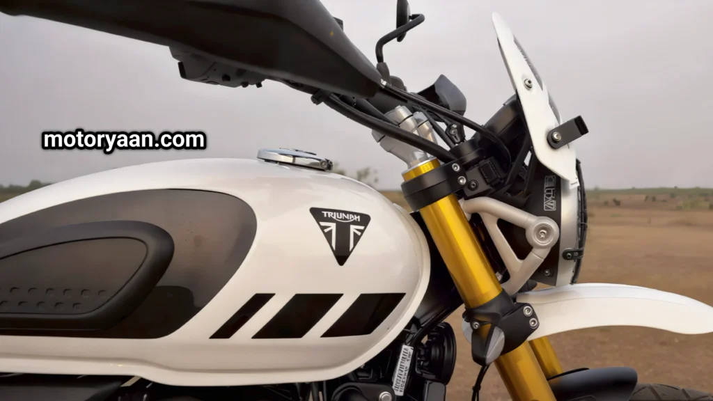 2025 Triumph Scrambler 400 XC side view showing fuel tank, LED headlight, and indicators