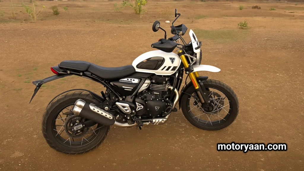 Side profile of the 2025 Triumph Scrambler 400 XC showcasing gold USD forks, high-mounted exhaust, and spoke wheels