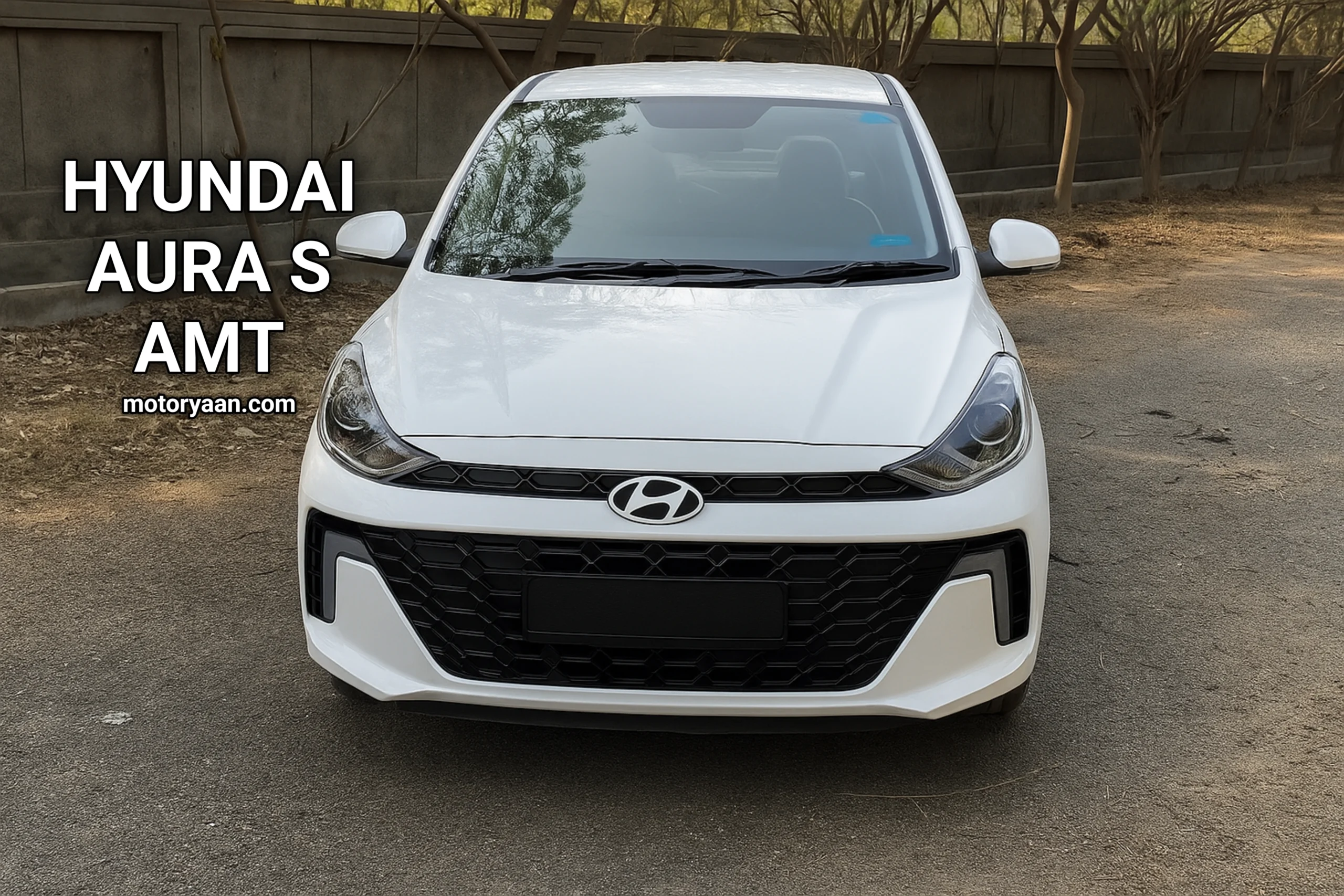 Front profile of Hyundai Aura S AMT showcasing bold bumper and updated grille