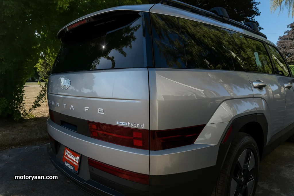 Rear and side view of 2025 Hyundai Santa Fe Hybrid with LED tail lamps and boxy silhouette