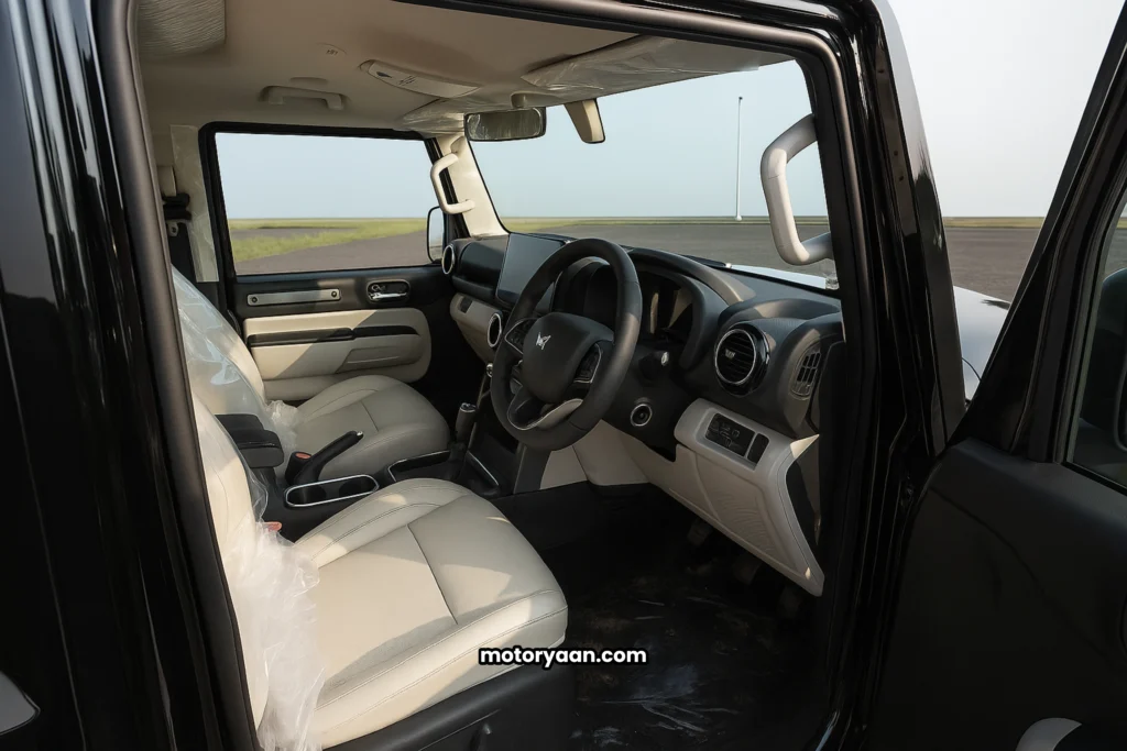 Mahindra Thar Roxx MX5 front interior with dashboard, seats, and infotainment system