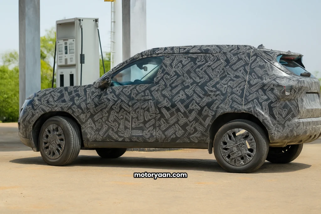 Nissan New Compact SUV Spied Testing in India 2026 side profile with alloy wheels, roof rails, and cladding.