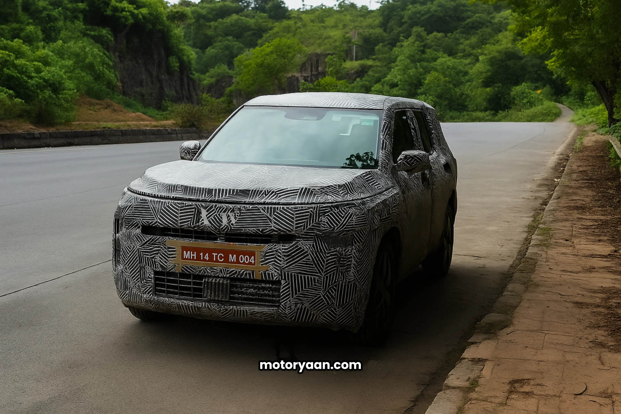 2025 Tata Sierra spied testing in Mumbai front profile heavily camouflaged SUV