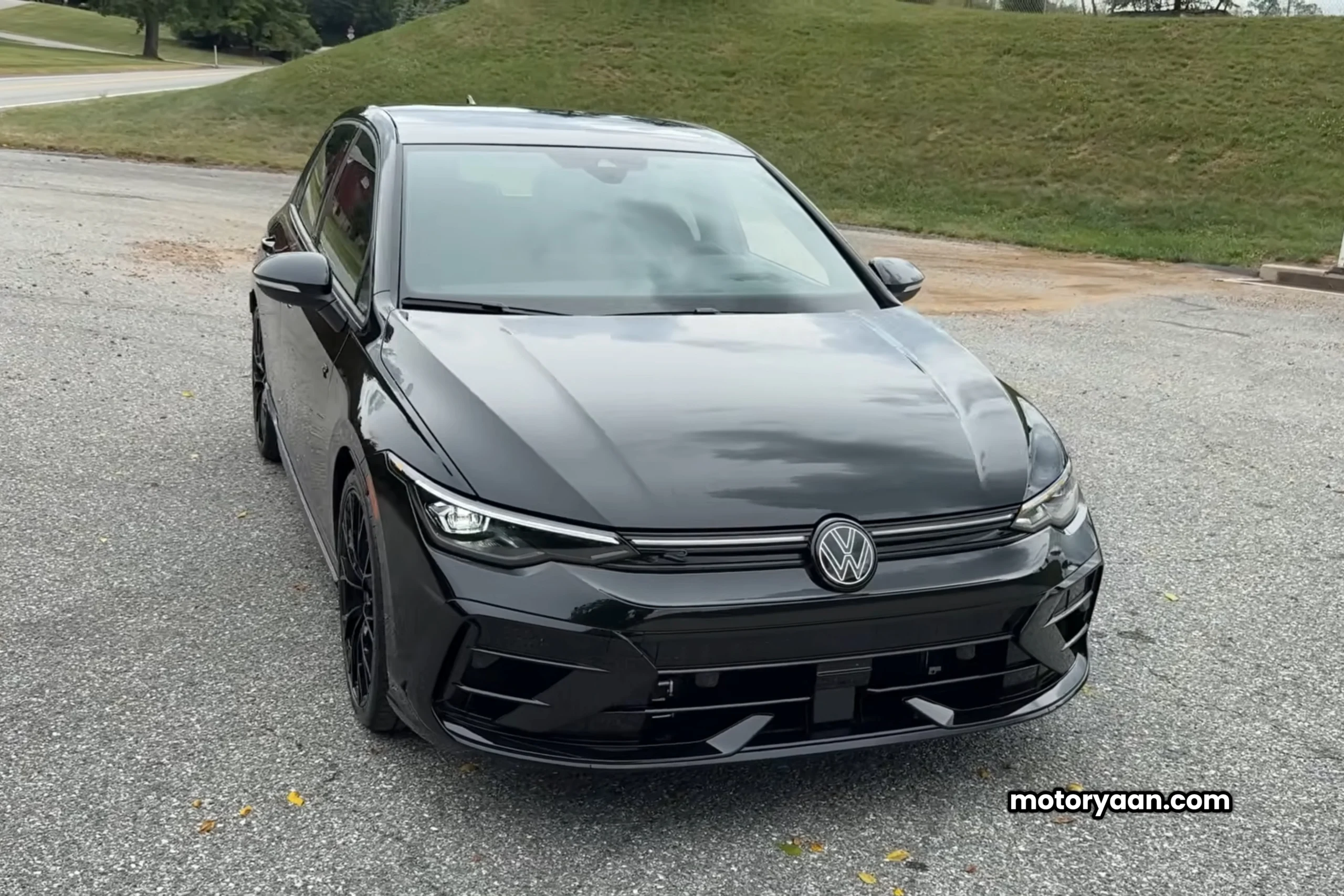 2025 Volkswagen Golf R Black Edition front profile showcasing LED headlights and blacked-out grille