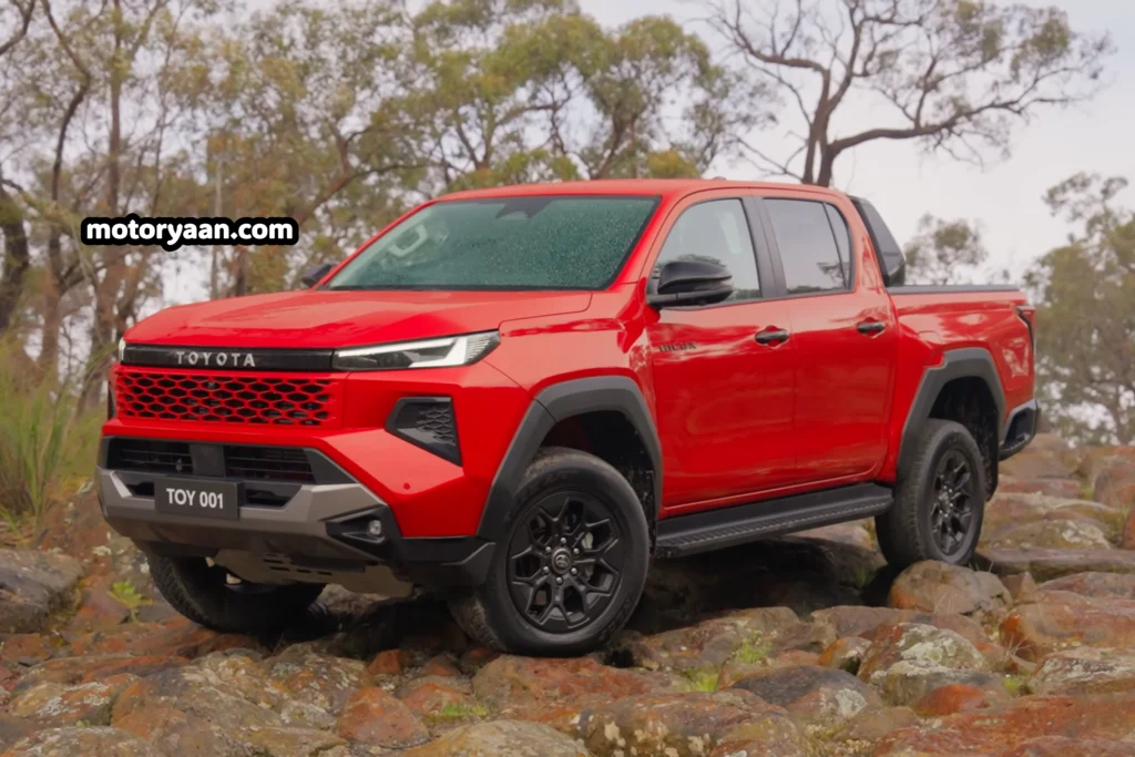 2026 Toyota Hilux front and side profile view showcasing aggressive headlights, grille, and body stance.