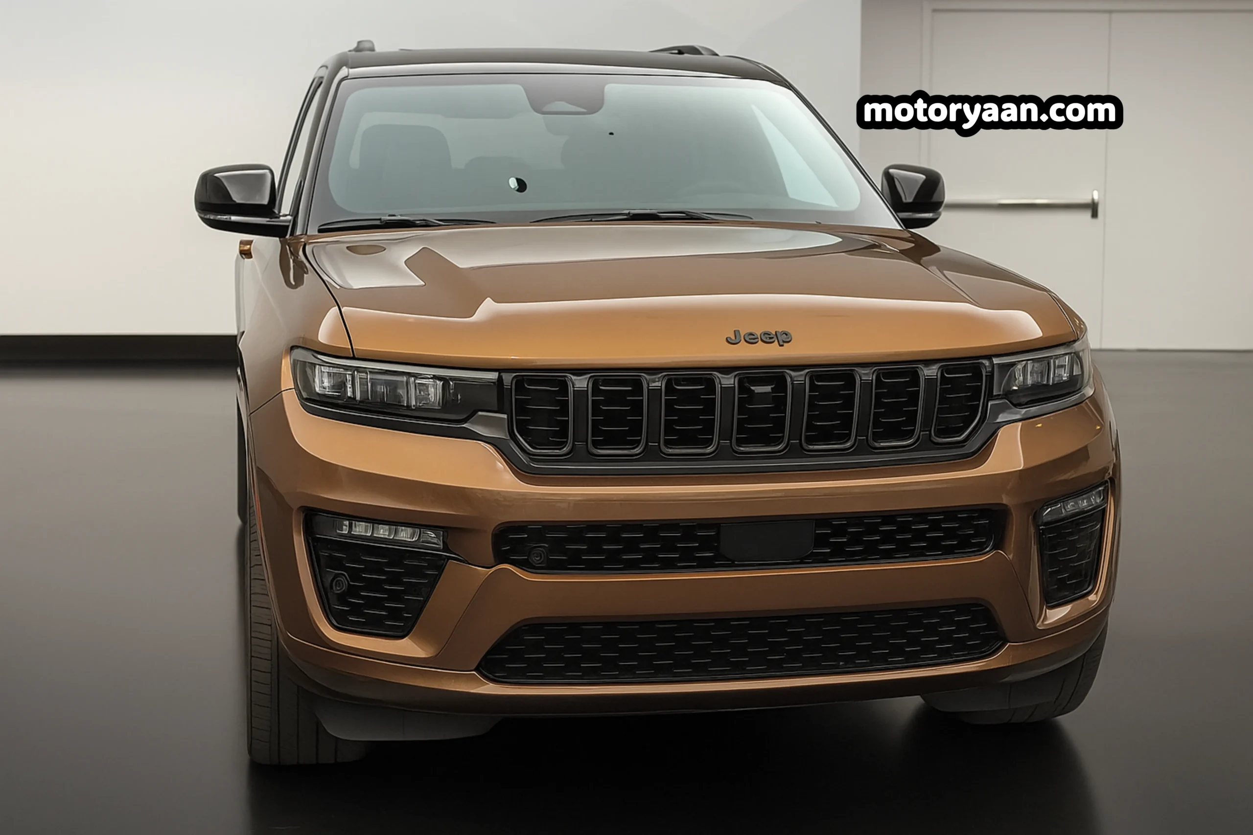 Front profile of the 2026 Jeep Grand Cherokee showcasing the redesigned grille and LED headlights.