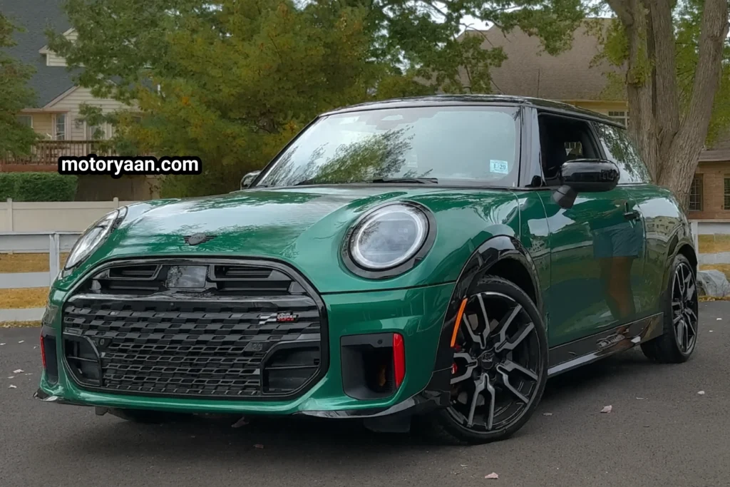 2025 Mini Cooper JCW front and side profile view in British Racing Green
