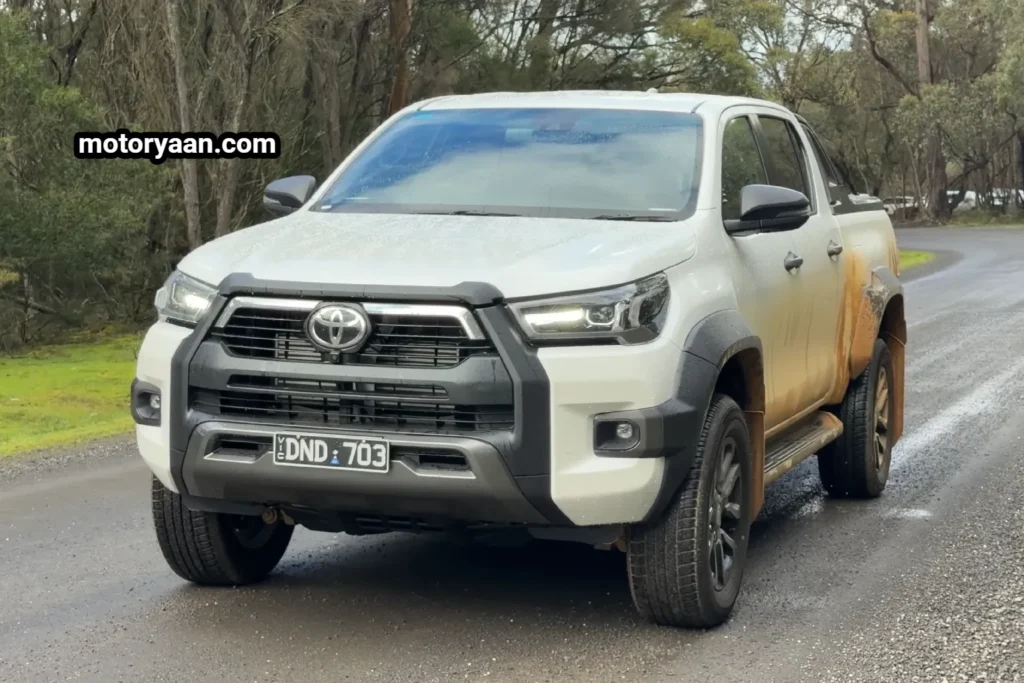 Old Toyota HiLux front and side profile showing rugged exterior and bold stance.