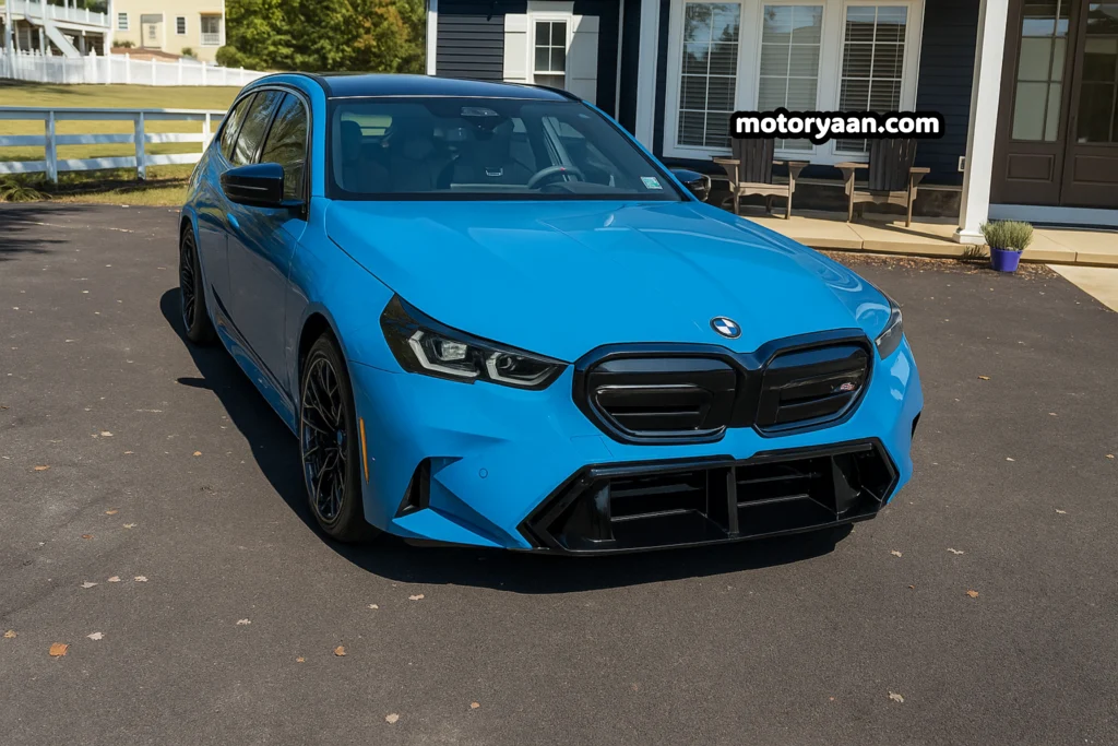 2026 BMW M5 Touring front profile showing aggressive grille and LED headlights