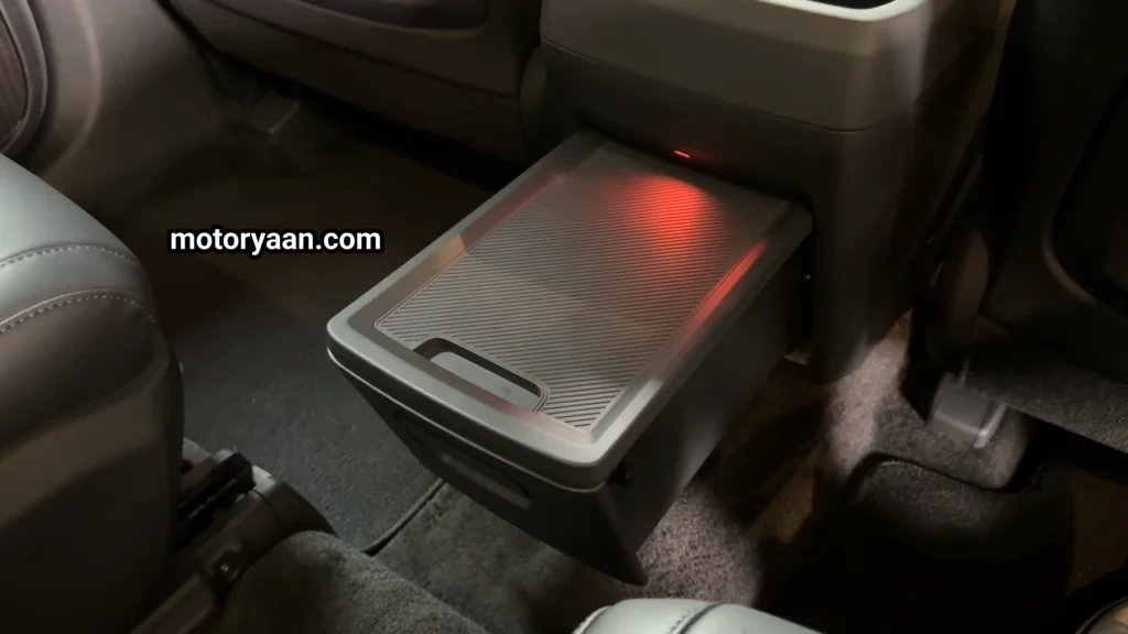 2027 Kia Telluride First Look rear seat sliding drawer storage and pull-out shelf.