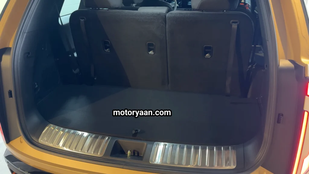 2027 Kia Telluride First Look boot space showing luggage area and folding seats.
