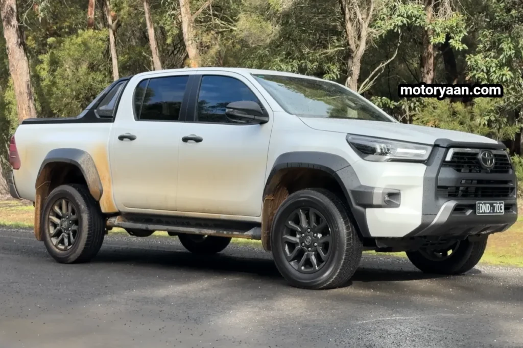 Old Toyota HiLux side profile highlighting classic pickup truck design.