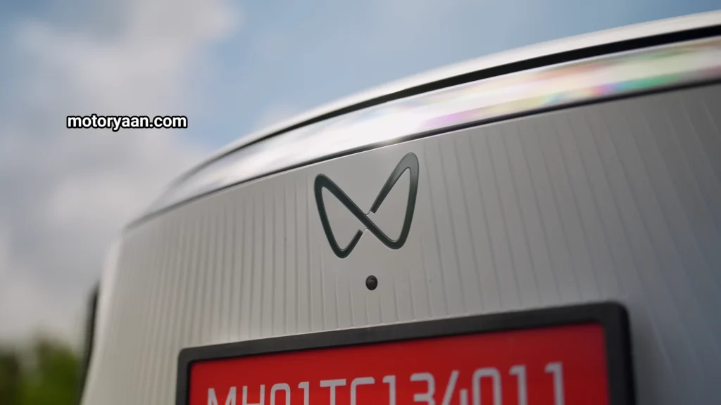 Mahindra XEV 9S front camera and Infiniti electric logo