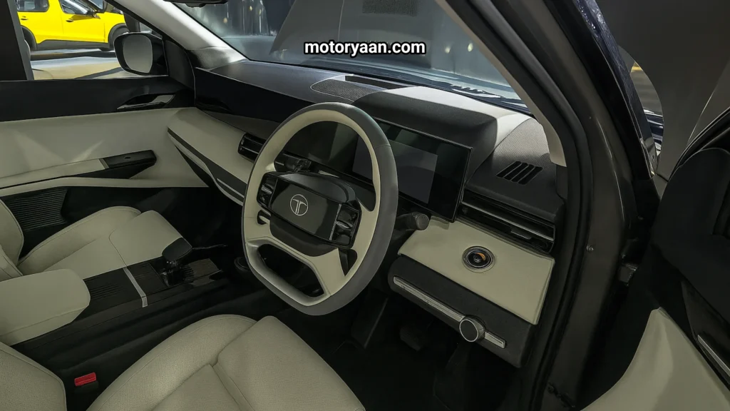 2025 Tata Sierra Accomplished Plus interior with triple screens, premium dashboard, steering wheel, and center console.