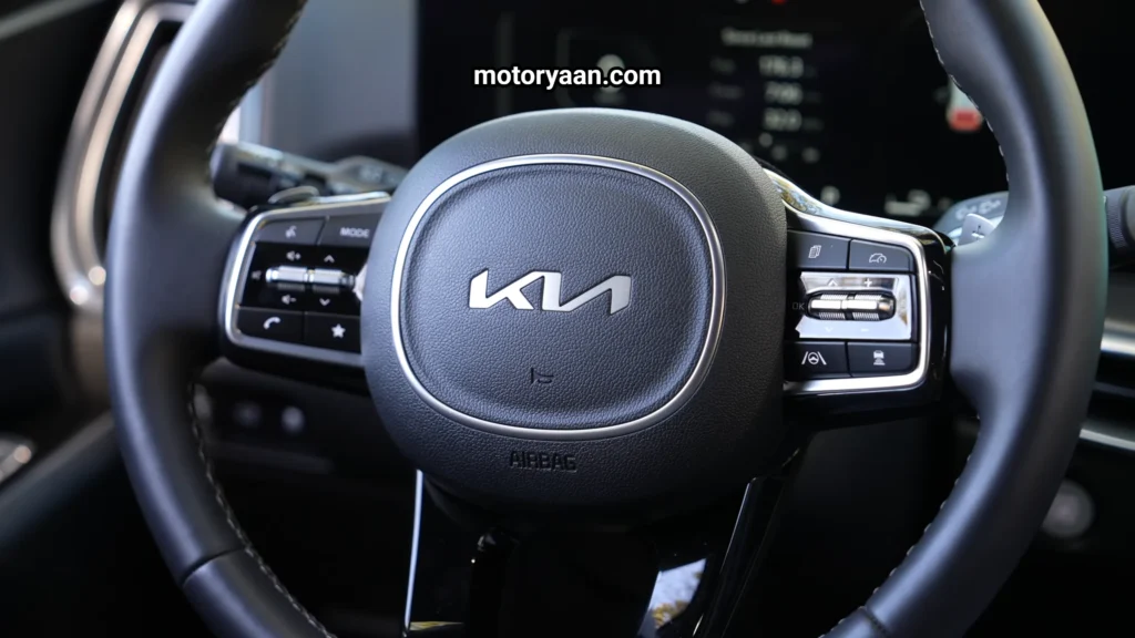 Steering mounted controls of the SUV featured in the Kia Sorento Hybrid Complete Technical Review.