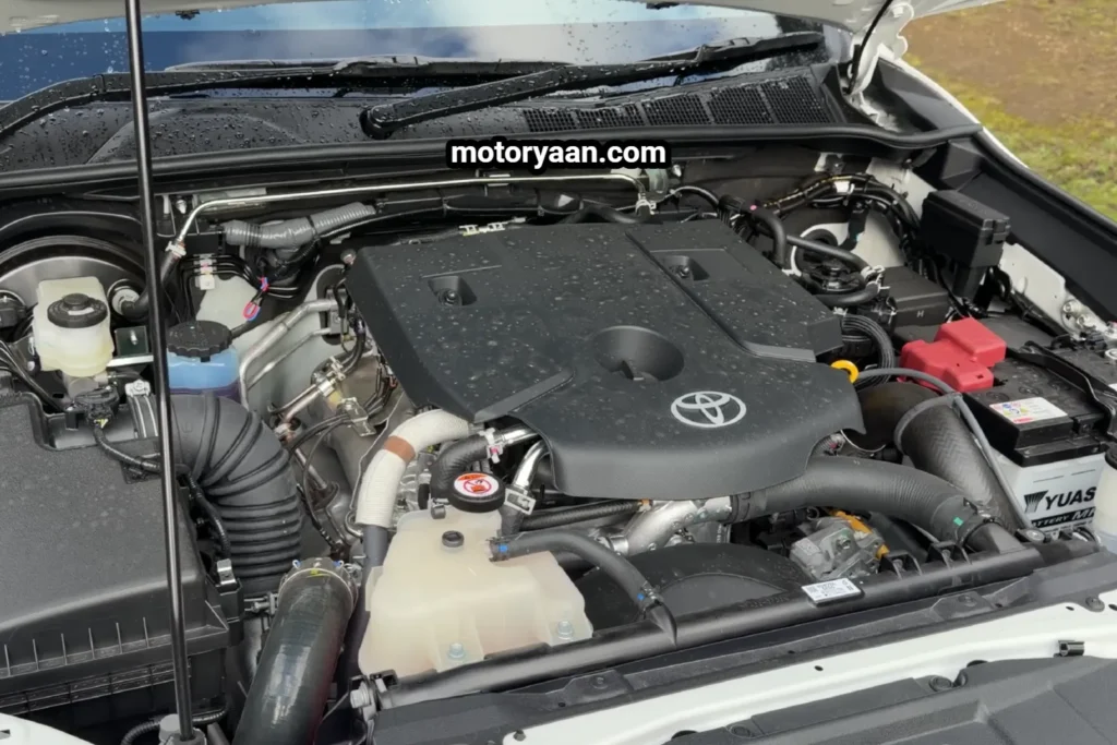 Old Toyota HiLux engine bay showing 2.8L turbo-diesel engine layout.