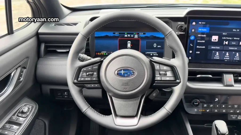 2026 Subaru Outback Touring XT interior with steering wheel instrument cluster and infotainment system