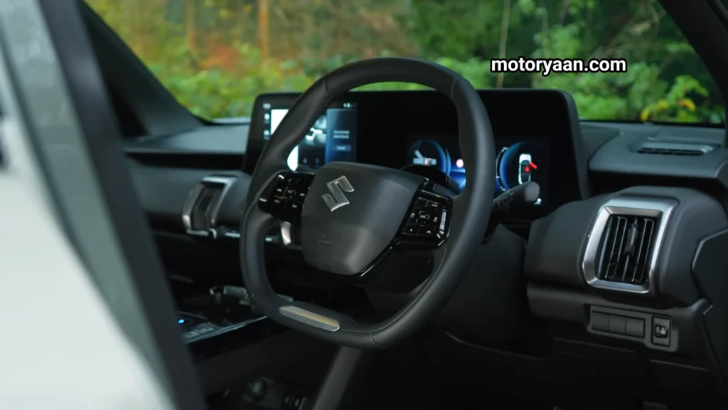 Suzuki Evitara front interior with steering wheel and motor controls in the Suzuki Evitara Review