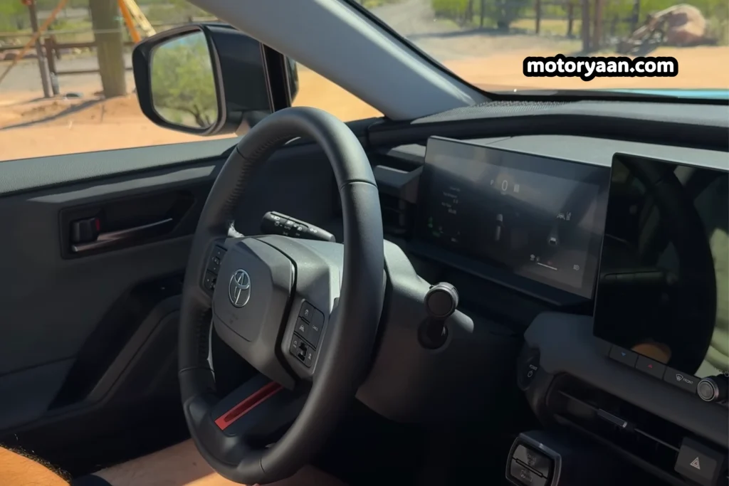 2026 Toyota RAV4 Woodland interior with steering wheel instrument cluster and infotainment system