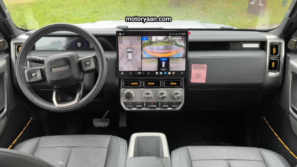 iCar V23 Review dashboard with steering controls, instrument cluster, and touchscreen display
