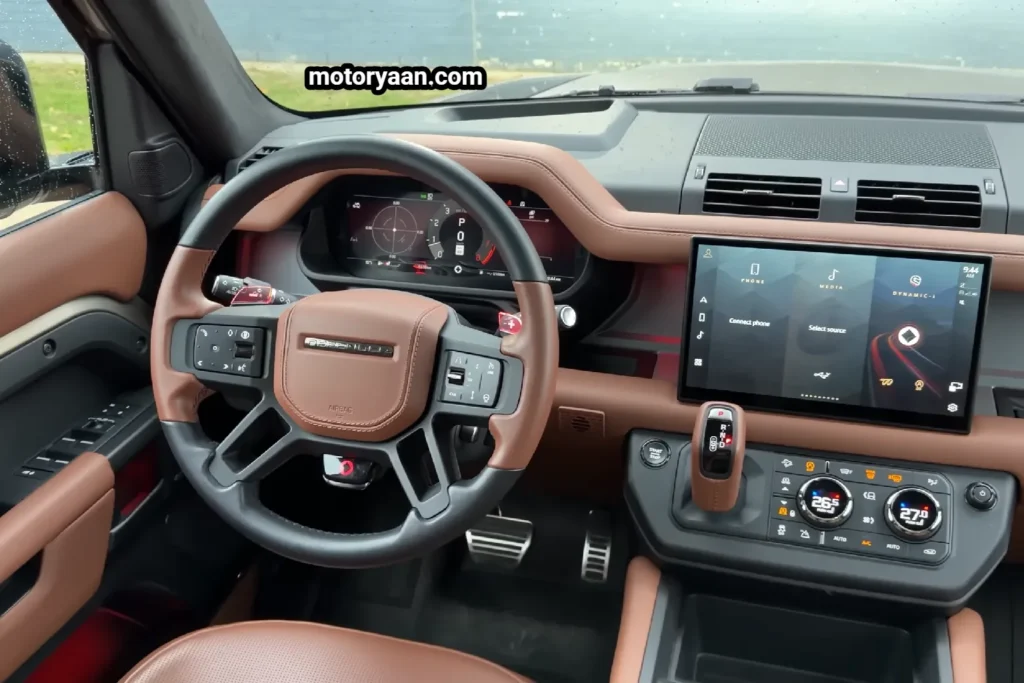2026 Land Rover Defender Octa front interior with steering wheel and infotainment system