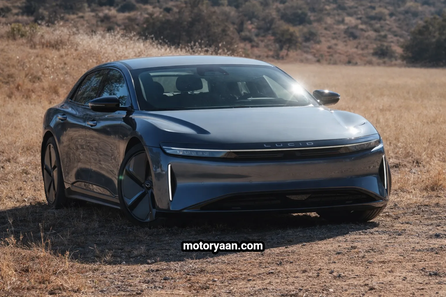 2026 Lucid Air Touring Review showing the front and side profile of the electric luxury sedan with aerodynamic design and low stance