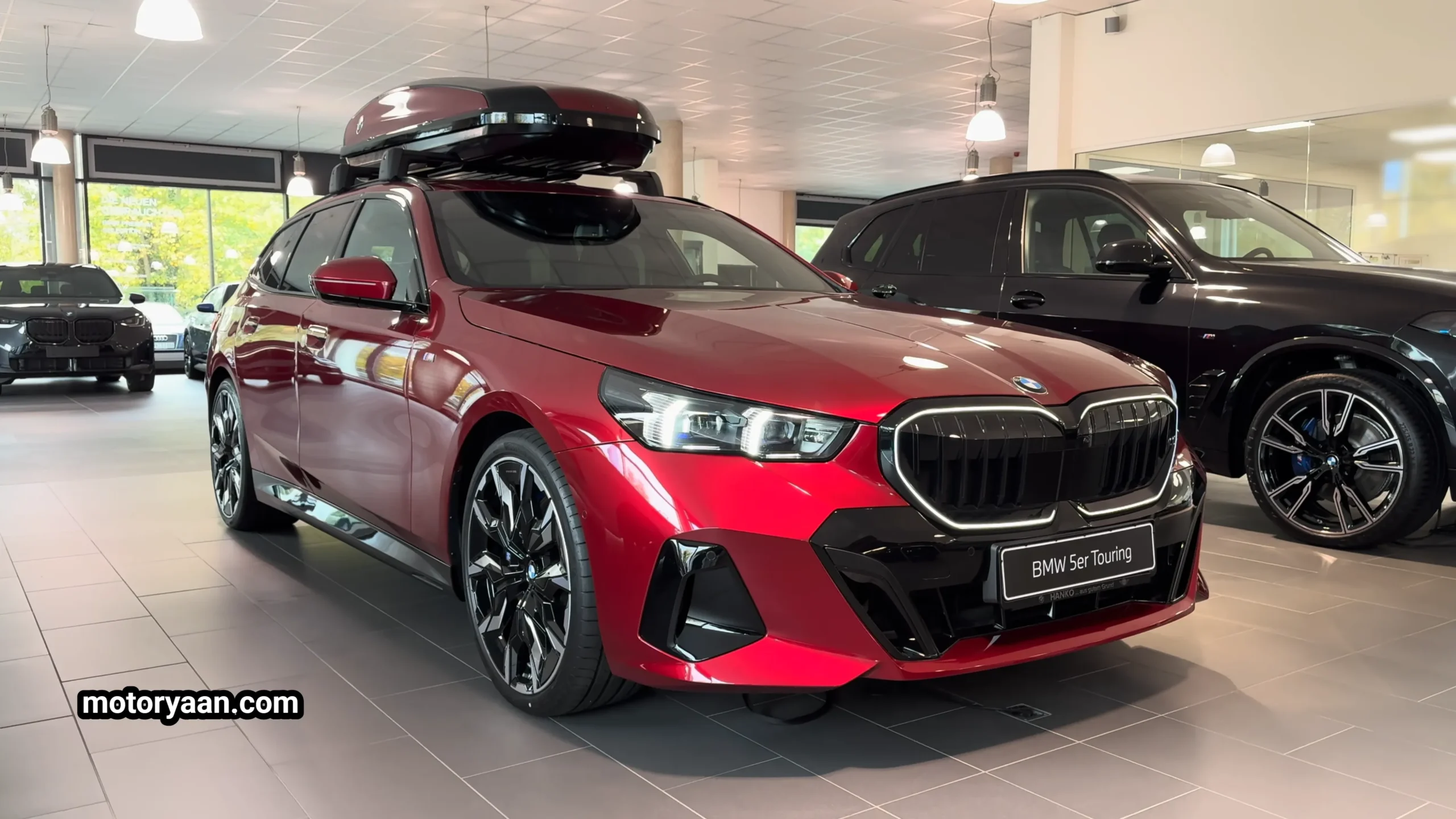 2026 BMW 5 Series 540d xDrive Touring front and side profile parked outdoors