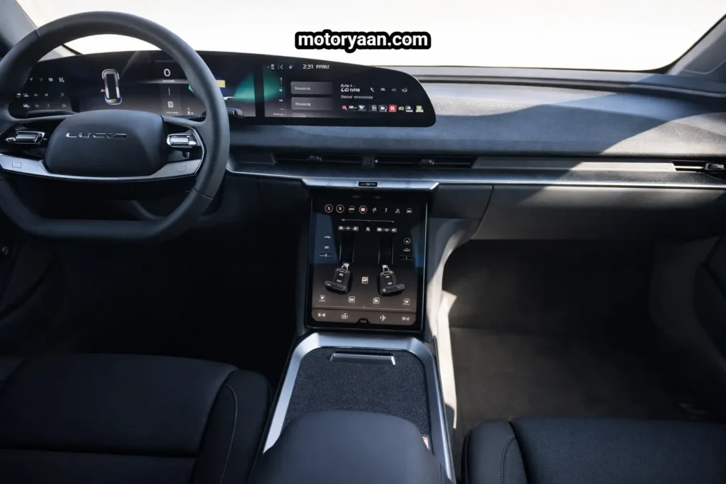 2026 Lucid Air Touring Review interior showing steering wheel, infotainment screen, digital instrument cluster, dashboard, front seats, and center console