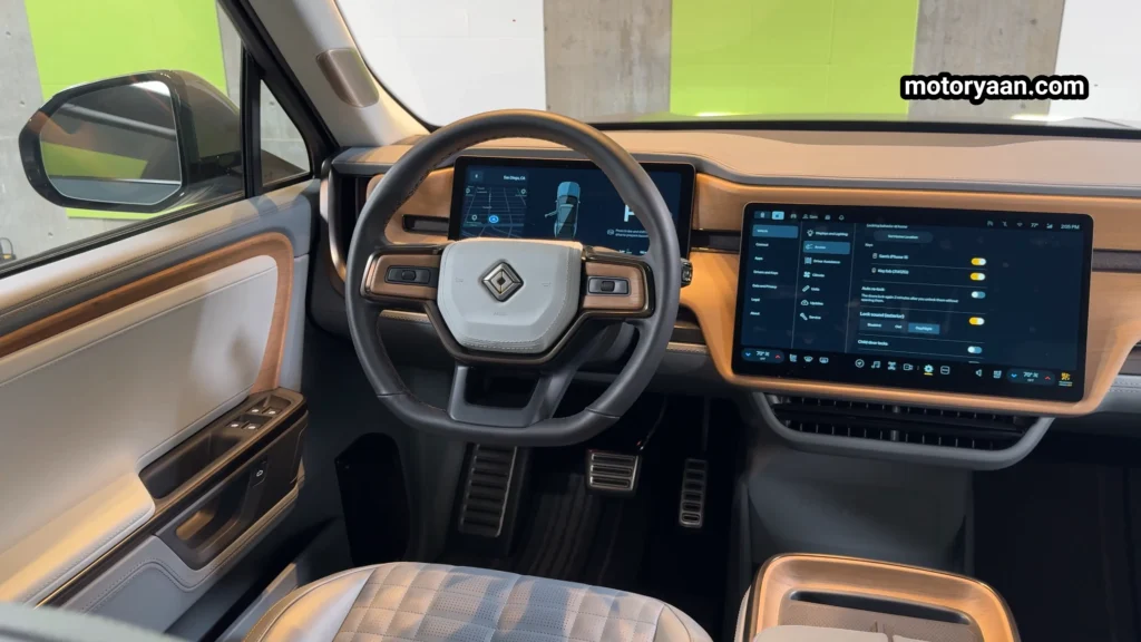 2026 Rivian R1S Quad Motor Review front interior steering wheel and infotainment system