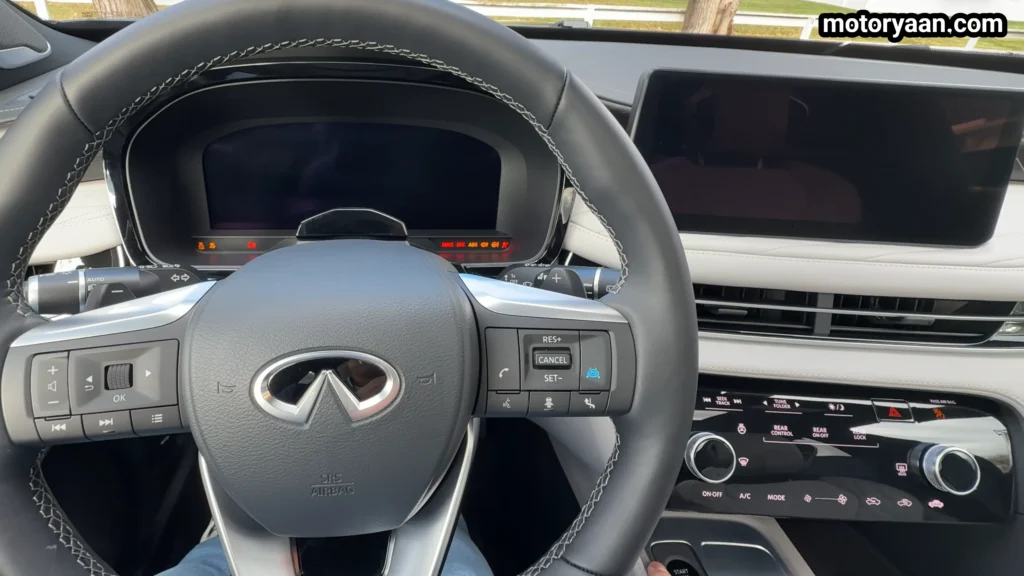 2026 Infiniti QX60 Review steering wheel, infotainment system, and AC controls