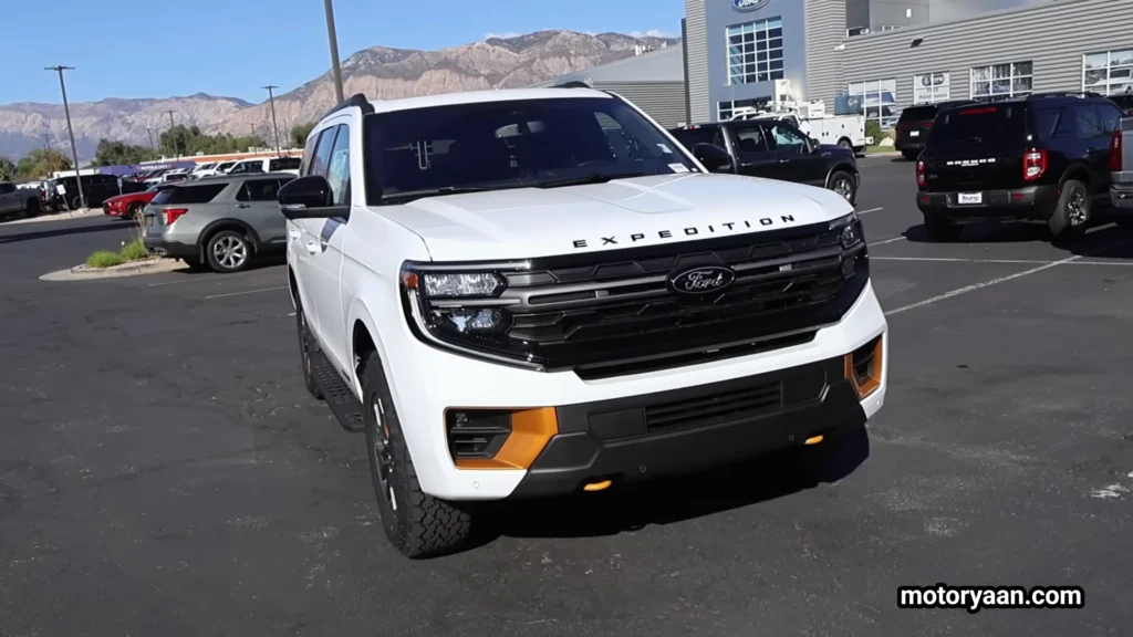 2026 Ford Expedition Tremor front profile parked on an urban street showcasing its bold SUV stance