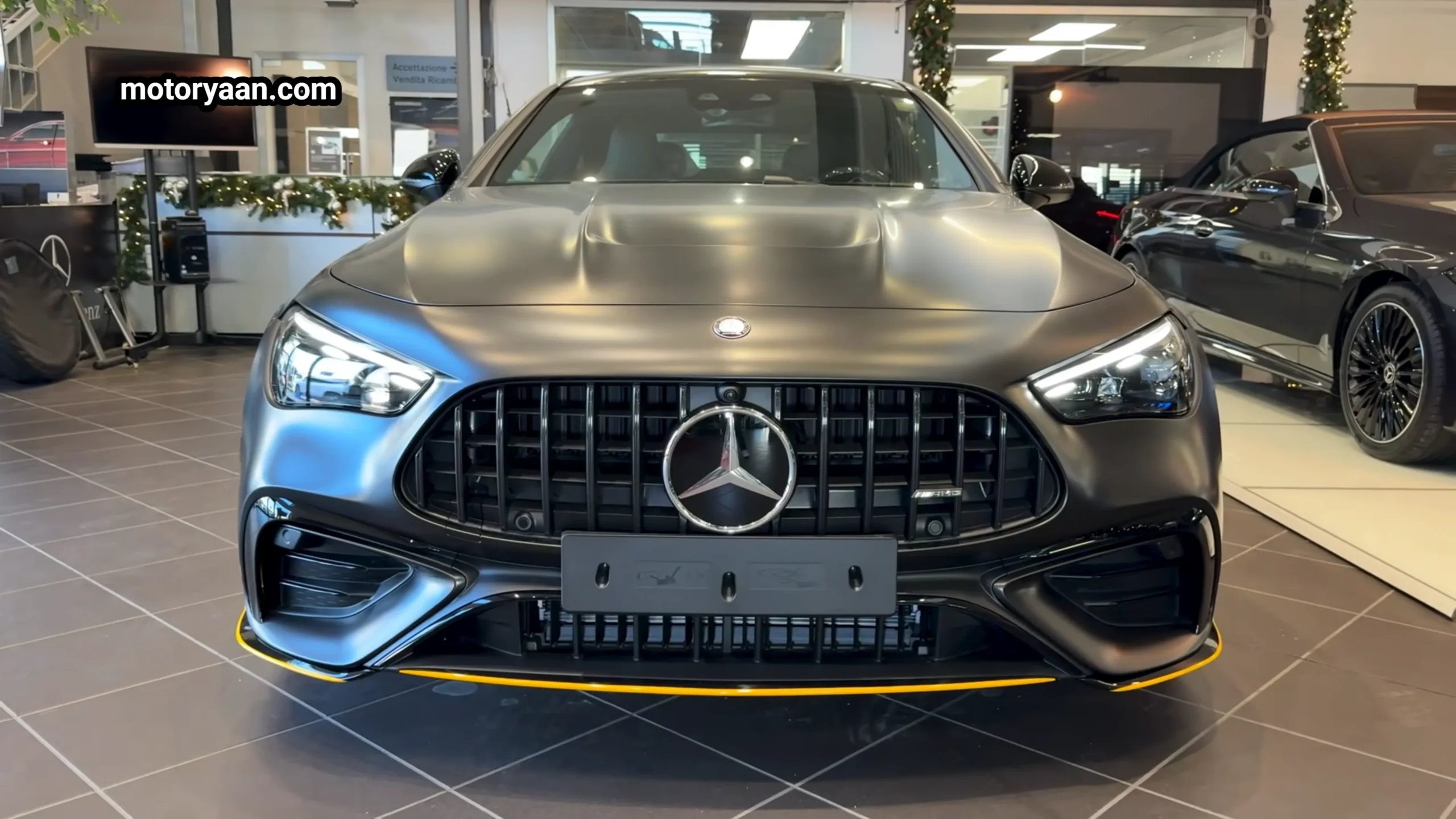 2026 Mercedes AMG CLE 53 Coupe front profile showing AMG Panamericana grille and aggressive bumper design