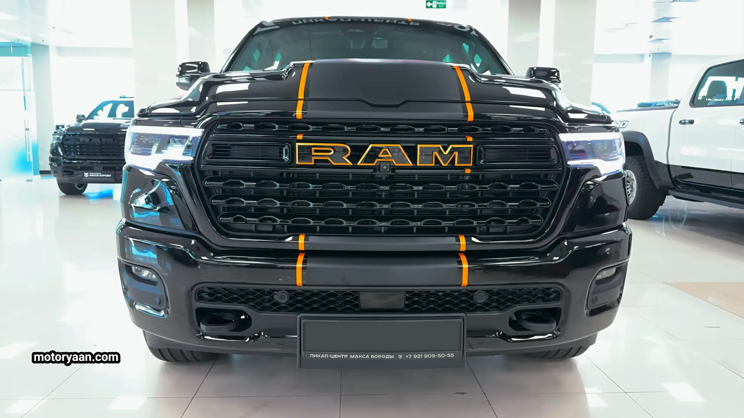 Front profile of 2026 Ram 1500 Limited with bold chrome grille and LED headlights