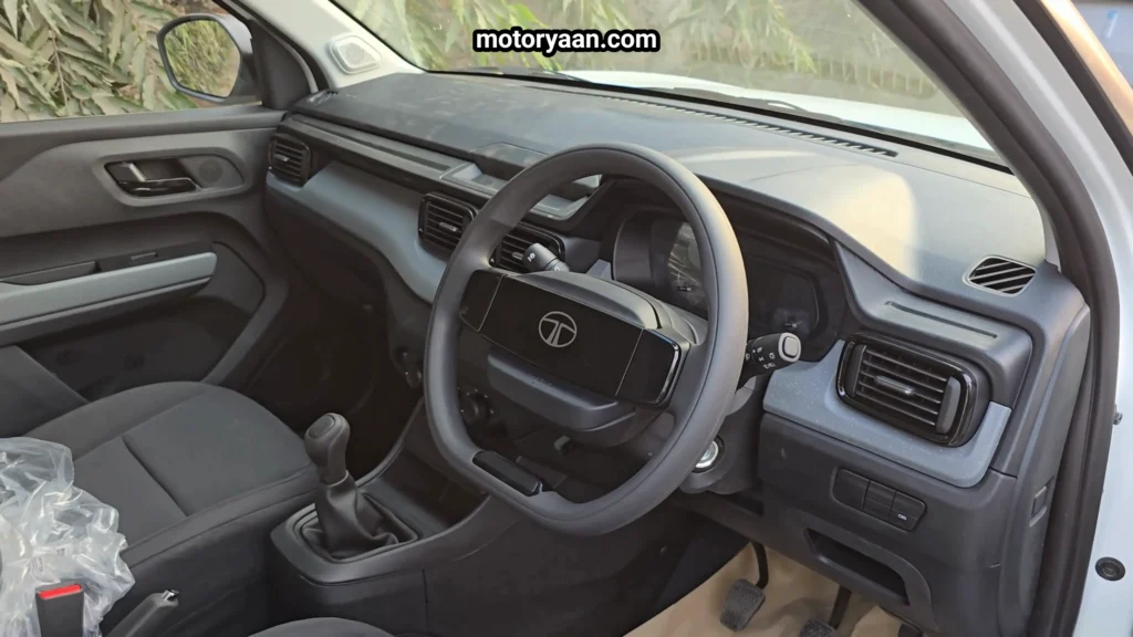 Front interior dashboard of Tata Punch Smart CNG 2026 Variant with steering wheel and instrument cluster
