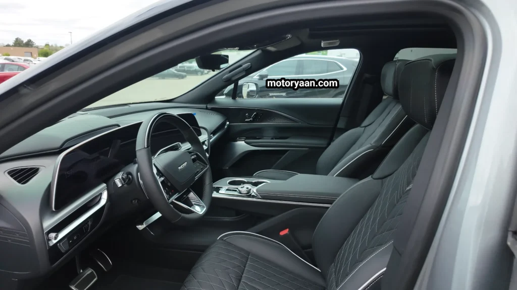 2026 Cadillac Lyriq V interior with curved display, steering wheel, and center console