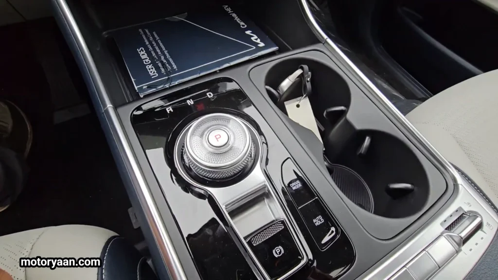 2026 Kia Carnival SX Prestige gear selector with cup holders and center console