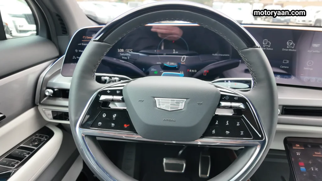 2026 Cadillac Vistiq steering wheel and digital instrument cluster close up