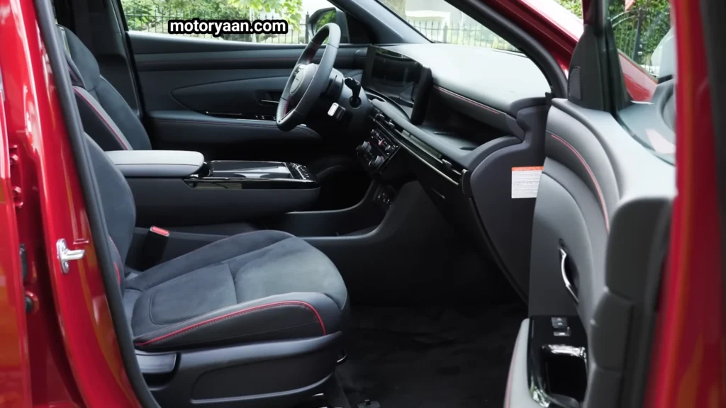 2026 Hyundai Tucson Hybrid front interior with seats, dashboard, and center console