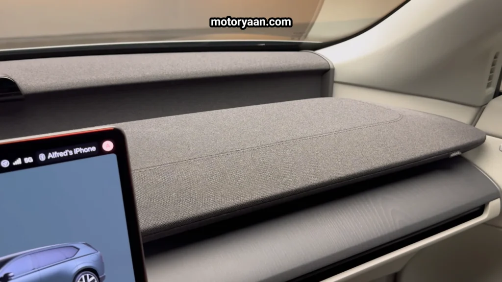 2027 Volvo EX60 dashboard material showing cloth trim and wood accents