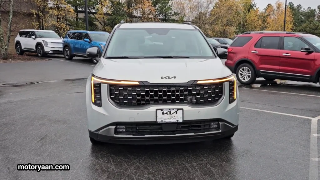 2026 Kia Carnival SX Prestige front profile with LED headlights and Kia tiger nose grille