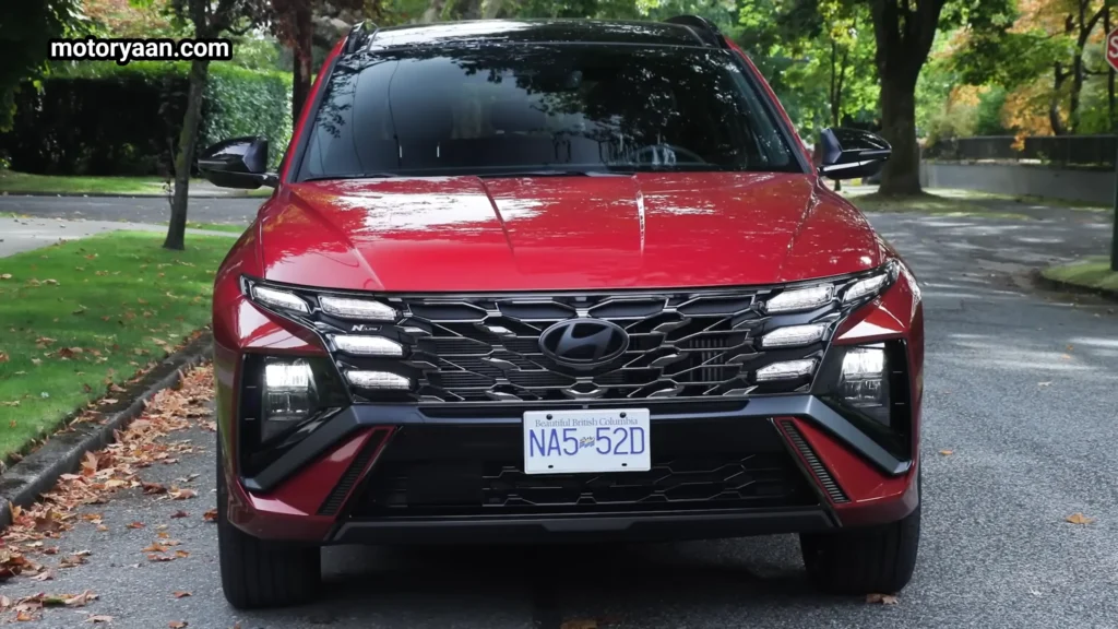 2026 Hyundai Tucson Hybrid front profile with parametric grille and LED headlamps