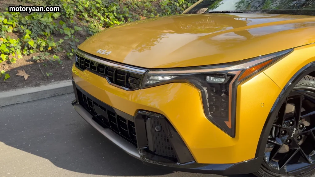2026 Kia K4 GT Line Turbo close up front profile with tiger nose grille and LED headlights