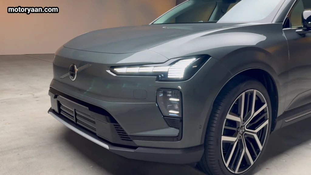 2027 Volvo EX60 close up front and side profile showing sealed grille and LED lighting design