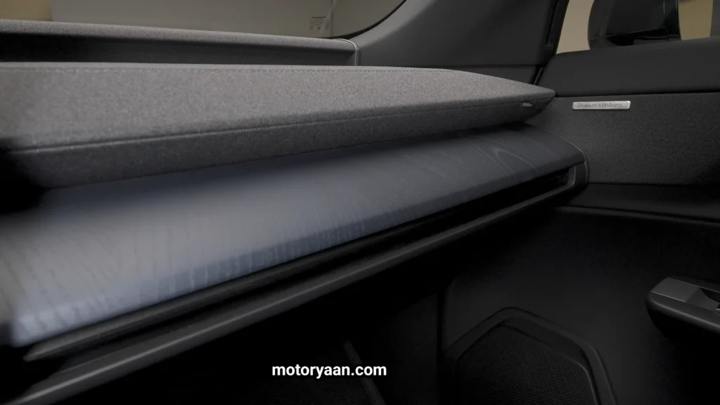 2027 Volvo EX60 Cross Country dashboard with fabric trim and wood finish