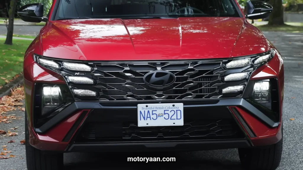 Close-up of 2026 Hyundai Tucson Hybrid front grille and LED lighting elements