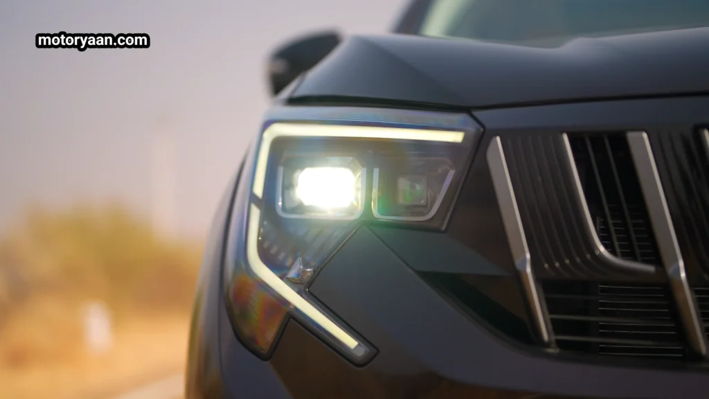Mahindra XUV 7XO facelift LED headlight close-up with projector setup and DRL signature
