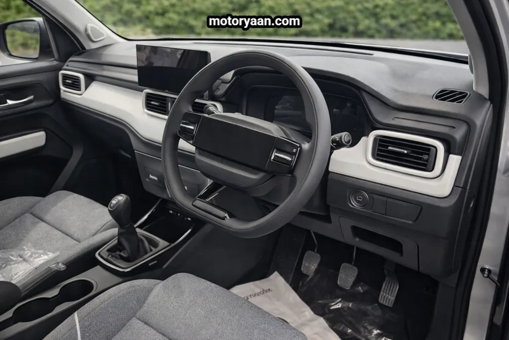 Tata Punch Facelift CNG interior showing steering wheel digital instrument cluster touchscreen infotainment and front seats