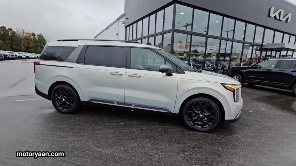 2026 Kia Carnival SX Prestige side profile with sliding doors and alloy wheels