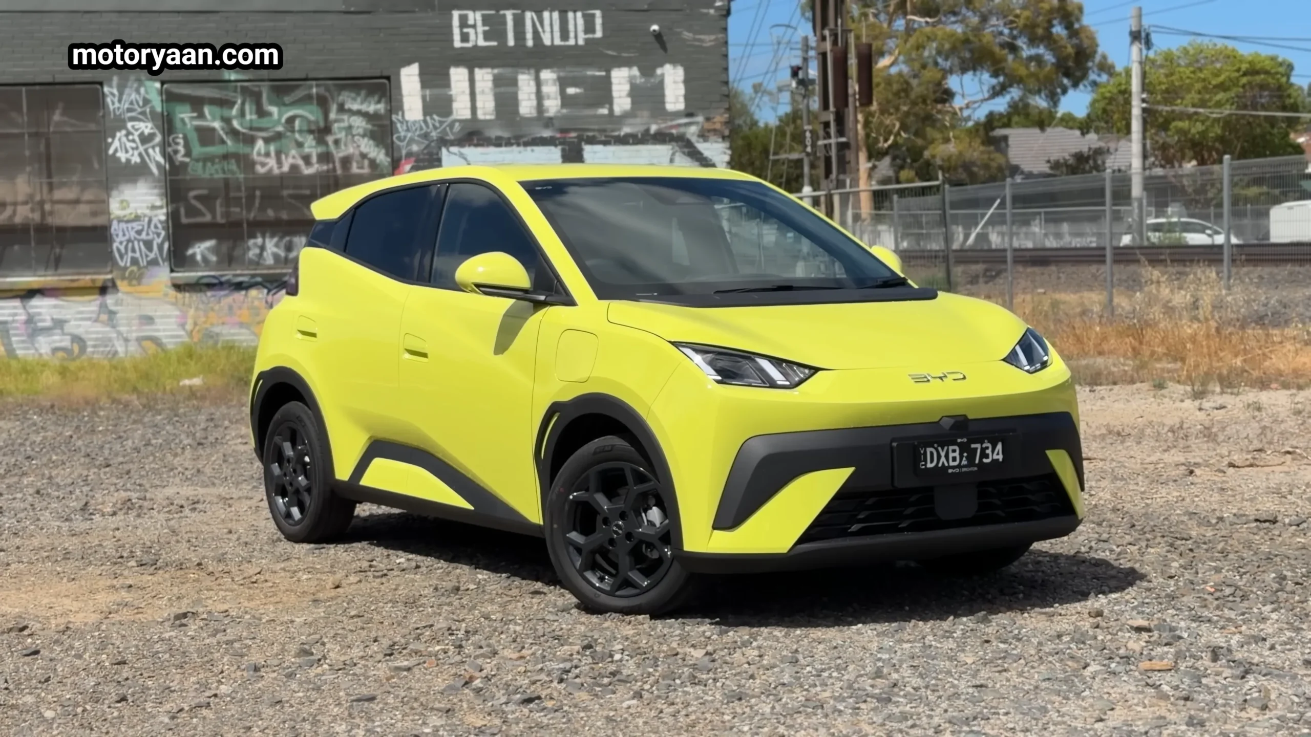 BYD1 Long Term Ownership front three quarter view showing sharp LED headlights and compact city EV stance